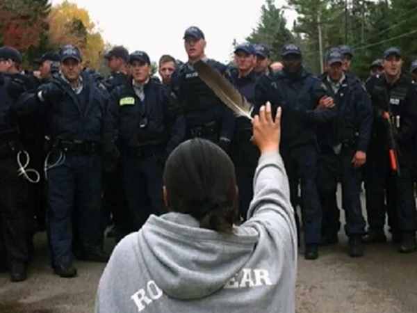 Amanda Polchies, in a famous image from the 2013 shale gas protests in Kent County. (CBC)