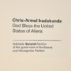Zidna natpisna pločica s imenom umjetnika i nazivom rada: Chris-Armel Iradukunda, God Bless the United States of Aliens — Solidarity Burundi Pavilion at the guest room of the Bosnia and Herzegovina Pavilion, Palazzo Malipiero, Venecija 2026.