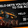VELO nagradni konkurs – McLaren F1 bolid u narandžasto-crnim bojama s VELO logom, uz slogan "VELO Gets You Closer to the Action" i QR kod za učešće u nagradnom takmičenju za vikend u Monzi. Samo za 18+.