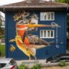 Mural umjetnika STOM 500 na fasadi zgrade u Sarajevu, prikaz ptice, kornjače i žabe